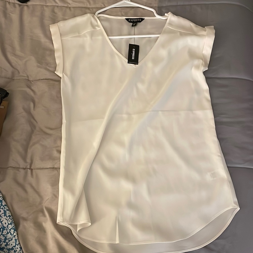 White v neck small sleeve shirt. Never worn before